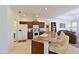 Well-appointed kitchen featuring a breakfast bar, granite countertops, and seamlessly opens to the living area at 3309 45Th E Ave, Bradenton, FL 34203