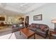 Spacious living room with plush seating, a ceiling fan, and an open layout for easy entertaining at 3309 45Th E Ave, Bradenton, FL 34203
