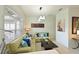 Inviting living room showcasing stylish sofas, a dark wood coffee table, and natural light at 3309 45Th E Ave, Bradenton, FL 34203