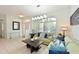 Open concept living room with contemporary furniture, decor and natural lighting at 3309 45Th E Ave, Bradenton, FL 34203