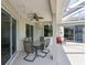Covered outdoor patio featuring a dining area with views of the landscaped backyard at 3309 45Th E Ave, Bradenton, FL 34203