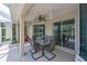 Relaxing covered patio with dining set, perfect for entertaining or enjoying outdoor meals at 3309 45Th E Ave, Bradenton, FL 34203