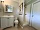 This bathroom has a vanity with mirror, toilet and walk-in shower at 3600 Wisteria Pl, Punta Gorda, FL 33950