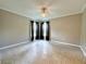 Neutral-toned bedroom with large windows at 3600 Wisteria Pl, Punta Gorda, FL 33950
