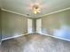 Spacious bedroom with neutral walls, ceiling fan, and two closets providing ample storage at 3600 Wisteria Pl, Punta Gorda, FL 33950