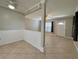 Open living room with tiled flooring and large windows, creating a cozy atmosphere at 3600 Wisteria Pl, Punta Gorda, FL 33950