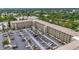 Aerial view of a large complex with extensive parking and mature landscaping at 3702 Lake Bayshore K-412 Dr # 412, Bradenton, FL 34205