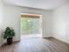 Large balcony with sliding door overlooking green landscape at 3702 Lake Bayshore K-412 Dr # 412, Bradenton, FL 34205