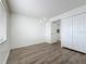 Bright bedroom with wood floors, closet, and natural light from the window at 3702 Lake Bayshore K-412 Dr # 412, Bradenton, FL 34205