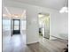 Inviting hallway that leads to the kitchen with stainless steel appliances and a view of the front door at 3702 Lake Bayshore K-412 Dr # 412, Bradenton, FL 34205