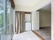 Washer and dryer hookups in a tiled room with sliding glass doors to the outside at 3702 Lake Bayshore K-412 Dr # 412, Bradenton, FL 34205