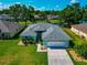 Aerial front view of single-story home with a manicured lawn at 3718 61St E Dr, Bradenton, FL 34203
