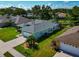 Aerial rear view of single-story home with a manicured lawn at 3718 61St E Dr, Bradenton, FL 34203