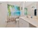 Bathroom featuring beach themed shower curtain, marble countertop vanity, and tile floors at 3718 61St E Dr, Bradenton, FL 34203