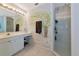 Charming bathroom featuring a palm tree mural, a glass shower, and bright lighting at 3718 61St E Dr, Bradenton, FL 34203