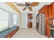 Cozy breakfast nook with large windows, built-in seating and storage, tile flooring, and access to the kitchen at 3718 61St E Dr, Bradenton, FL 34203