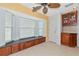 Bright breakfast nook with large windows, built-in storage, tile flooring, and access to the kitchen at 3718 61St E Dr, Bradenton, FL 34203