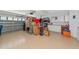 Spacious garage with ample storage, bright lighting, and a clean, epoxy floor at 3718 61St E Dr, Bradenton, FL 34203