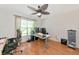 Home office with hardwood floors, a ceiling fan, and a large window for plenty of natural light at 3718 61St E Dr, Bradenton, FL 34203