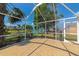 Screened lanai features a tile floor and peaceful water views at 3718 61St E Dr, Bradenton, FL 34203
