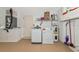 Functional laundry room with modern washer, dryer, and storage cabinets at 3718 61St E Dr, Bradenton, FL 34203