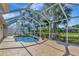 Relaxing screened-in pool area with a refreshing pool, deck, and mature landscaping at 3718 61St E Dr, Bradenton, FL 34203