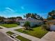 Well-manicured lawn and landscaping surround this single-story home at 3718 61St E Dr, Bradenton, FL 34203