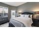 Bedroom with dark furniture, a lamp, and views of the pool at 3806 72Nd E Ter, Sarasota, FL 34243