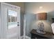 Bedroom featuring a decorative lamp, dark furniture, and a door with a view of the pool at 3806 72Nd E Ter, Sarasota, FL 34243