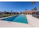Sparkling community pool with ample seating and privacy fencing at 3806 72Nd E Ter, Sarasota, FL 34243