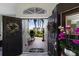 Welcoming entryway features double doors, flower wreaths, and a view of the well maintained front yard at 3806 72Nd E Ter, Sarasota, FL 34243