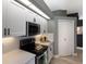 Updated kitchen featuring stainless steel appliances, white cabinets, quartz countertops, and modern fixtures at 3806 72Nd E Ter, Sarasota, FL 34243
