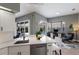 Bright kitchen featuring a sink, modern appliances, island with seating, and views of the pool and backyard at 3806 72Nd E Ter, Sarasota, FL 34243