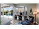 Bright home office featuring a built-in desk, a bay window, and a view of the pool at 3806 72Nd E Ter, Sarasota, FL 34243
