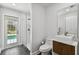 Contemporary bathroom boasts walk-in shower, modern vanity and black tile flooring at 3919 Fan Palm Ct, Land O Lakes, FL 34638