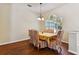 Bright dining room with a large window and a table set for six, perfect for Gathering meals at 3919 Fan Palm Ct, Land O Lakes, FL 34638