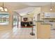Open concept living space offering seamless flow from the kitchen to the living room and pool area at 3919 Fan Palm Ct, Land O Lakes, FL 34638
