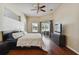 Spacious main bedroom with sliding glass door access to the lanai and a neutral color palette at 3919 Fan Palm Ct, Land O Lakes, FL 34638