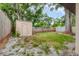A quaint backyard with a storage shed, partial fencing, and lush greenery at 4023 Chestnut Ave, Sarasota, FL 34234