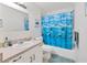 Bathroom featuring a dolphin-themed shower curtain and sink at 4023 Chestnut Ave, Sarasota, FL 34234