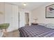 Comfortable bedroom with large stamp art piece and storage at 4023 Chestnut Ave, Sarasota, FL 34234