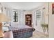 Cozy bedroom with large window and wooden bookshelf at 4023 Chestnut Ave, Sarasota, FL 34234