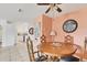 Charming dining room with wooden table and decorative clock at 4023 Chestnut Ave, Sarasota, FL 34234