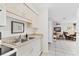 Well-lit kitchen featuring stainless steel sink and neutral countertops at 4023 Chestnut Ave, Sarasota, FL 34234