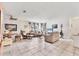 Bright and airy living room with neutral tones, tile flooring, and comfortable seating arrangements for relaxation and entertaining at 4023 Chestnut Ave, Sarasota, FL 34234
