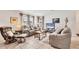 Cozy living room filled with natural light, comfortable reclining sofas, and a neutral color palette for relaxation at 4023 Chestnut Ave, Sarasota, FL 34234