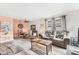 Open concept living and dining area with tile flooring, comfortable seating, and a warm, inviting atmosphere at 4023 Chestnut Ave, Sarasota, FL 34234