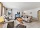 Comfortable living room with tile floors and cozy seating, perfect for relaxation and enjoying entertainment at 4023 Chestnut Ave, Sarasota, FL 34234