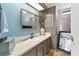 Charming bathroom with modern fixtures and a unique peacock feather arrangement above the sink at 4119 13Th E St, Ellenton, FL 34222