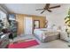 The bedroom includes a ceiling fan, storage, and a warm, inviting decor scheme at 4119 13Th E St, Ellenton, FL 34222